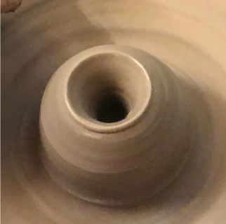 clay pot on the pottery wheel